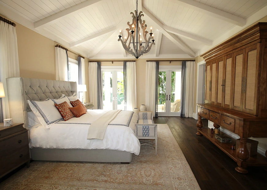 Luxurious Bedroom with Vaulted Ceiling and Wooden Wardrobe