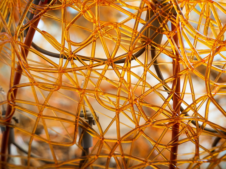 Abstract Close-Up of Amber Plastic Mesh Texture