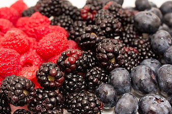 Close-up of fresh raspberries, blackberries, and blueberries