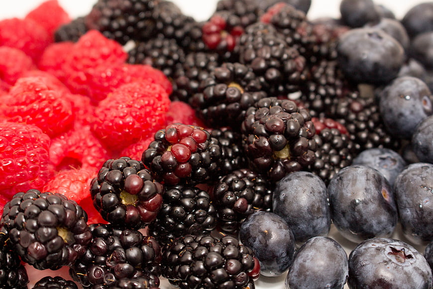 Close-up of fresh raspberries, blackberries, and blueberries