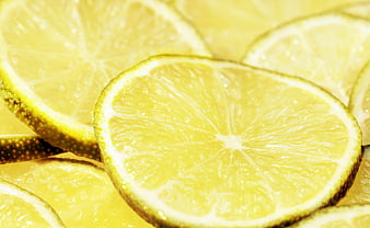 Close-up of fresh yellow lemon slices with juicy texture