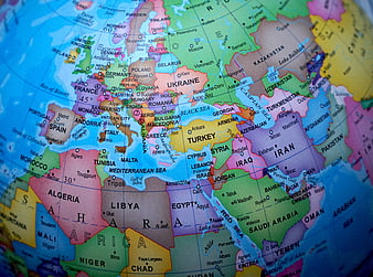 Close-up of a colorful globe map showing Europe, Africa, and the Middle East