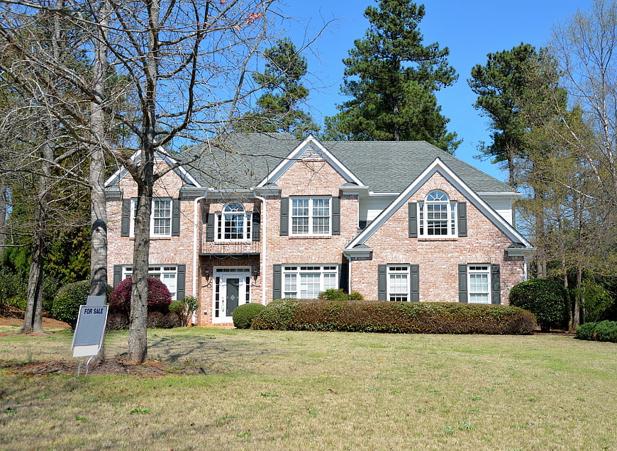 Two-Story Brick Home For Sale With Landscaped Front Yard