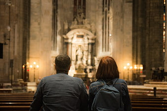 Couple Praying in Church Interior