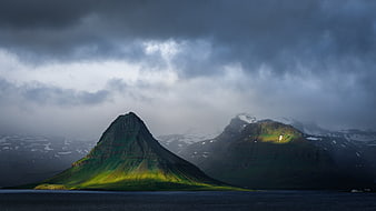 Dramatic Kirkjufell Mountain Landscape with Sunbeams