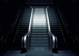 Symmetrical Escalators and Staircase in Dark Underground Station
