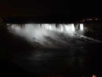Majestic Niagara Falls illuminated at night with long exposure