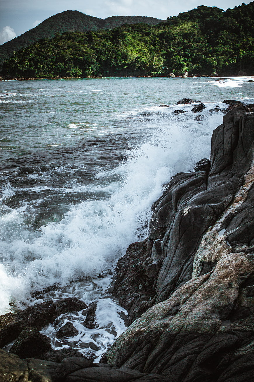 Powerful Ocean Waves Crashing Against Rocky Coastline