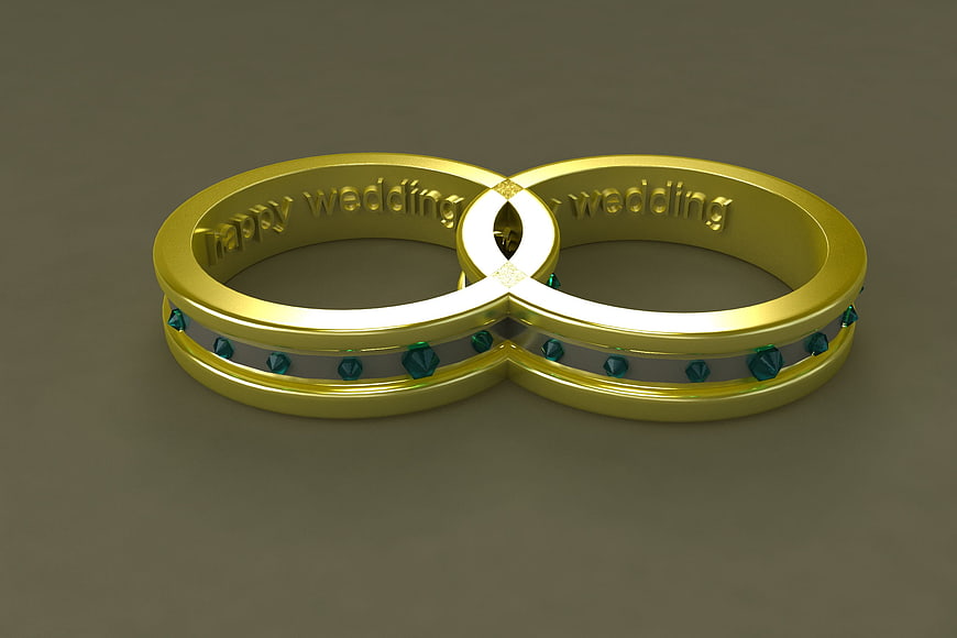 3D Rendered Gold Wedding Rings with Emerald Accents