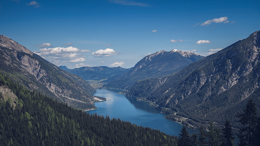 Panoramic Alpine Lake Valley with Forested Mountains
