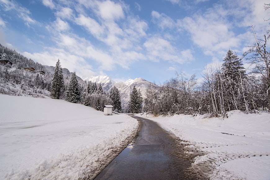 Winding Winter Road Through Snowy Austrian Alps