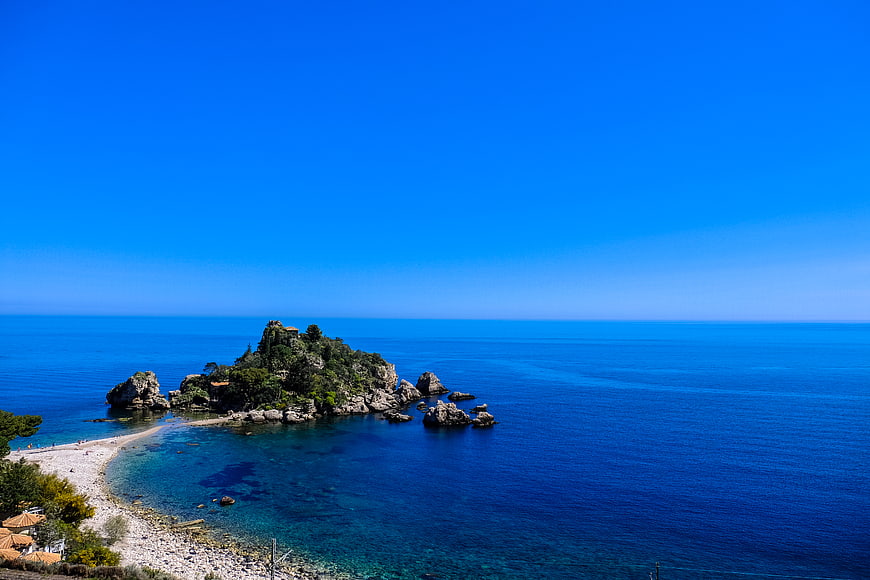 Stunning Blue Sky and Sea View of a Rocky Island Beach