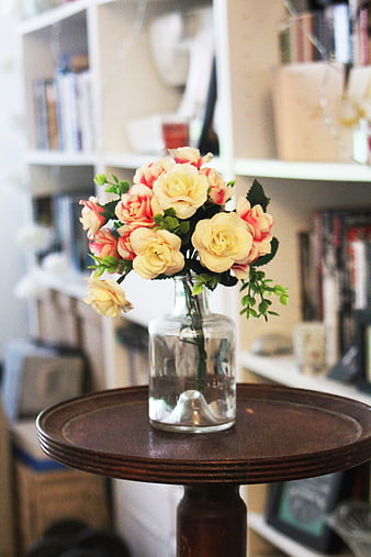 Yellow and Pink Artificial Roses in Glass Vase on Wooden Table