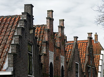 Traditional Dutch Brick Houses with Stepped Gables and Chimneys