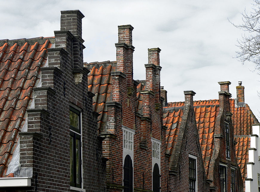 Traditional Dutch Brick Houses with Stepped Gables and Chimneys