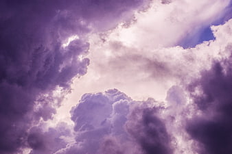 Dramatic purple and white clouds in a moody sky