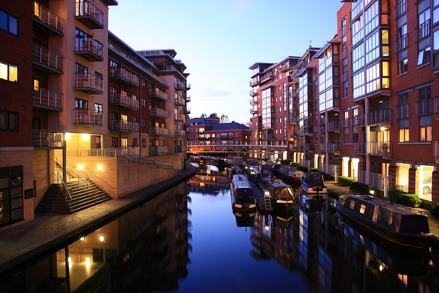 Birmingham Canal Basin at Dusk with Moored Boats and Brick Apartments