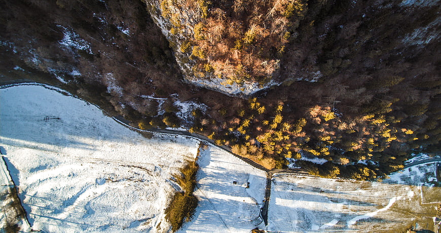 Aerial View of Snowy Winter Forest and Fields