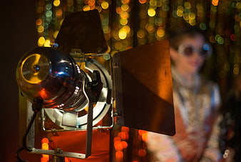 Close-up of vintage stage spotlight with bokeh background