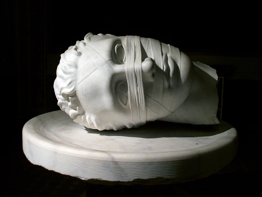 Marble Sculpture of Head Wrapped in Bandages on Pedestal