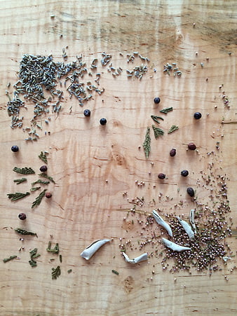 Dried herbs and botanicals arranged on a wooden surface