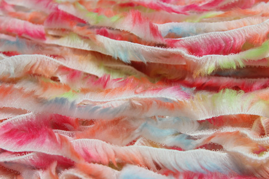 Close-up of colorful pastel yarn strips texture