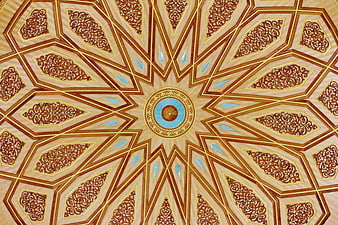 Intricate Islamic geometric ceiling pattern with gold and blue details