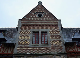 Historic Brick House Facade with Decorative Patterns