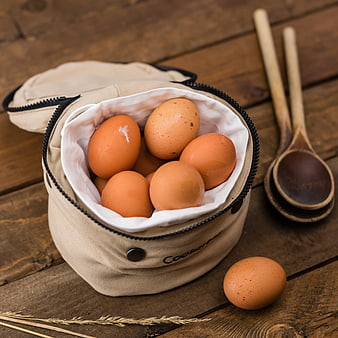 Brown Eggs in Canvas Bag on Wooden Table