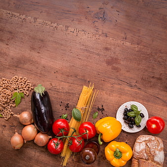Italian pasta ingredients on rustic wooden table background