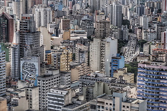 Aerial View of Dense Urban Cityscape with Skyscrapers and Traffic