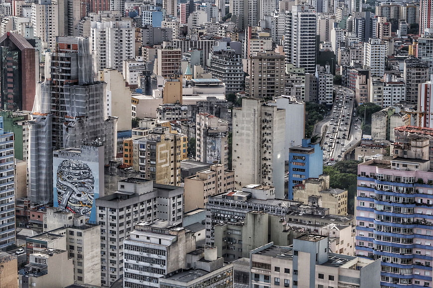Aerial View of Dense Urban Cityscape with Skyscrapers and Traffic