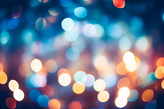 Abstract colorful bokeh lights background with blue and orange tones