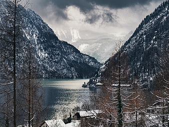 Snowy Alpine Lake Valley with Mountains and Winter Trees