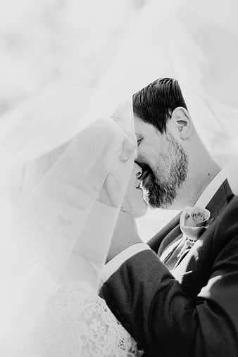Romantic Black and White Wedding Kiss Under Veil