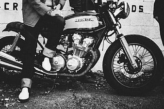 Vintage Black and White Honda Motorcycle with Rider