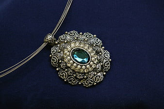 Vintage Silver Necklace with Green Gemstone on Blue Velvet