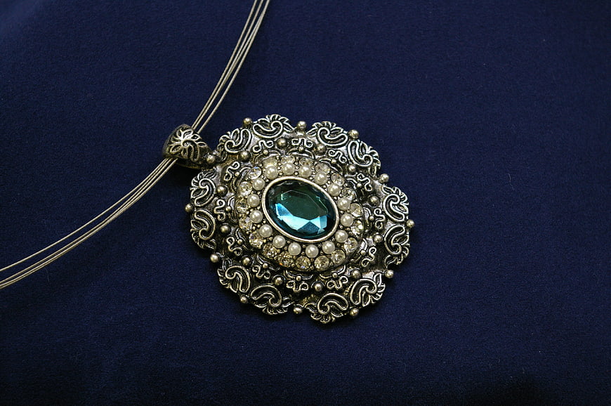 Vintage Silver Necklace with Green Gemstone on Blue Velvet