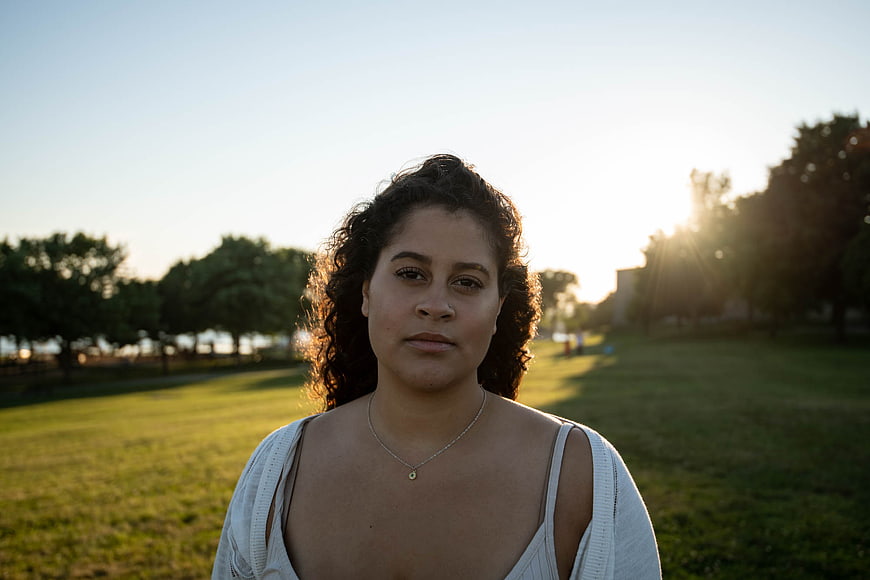 Portrait of Young Woman in Park at Sunset