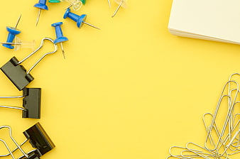 Yellow Office Supplies Flat Lay with Binder Clips and Paperclips