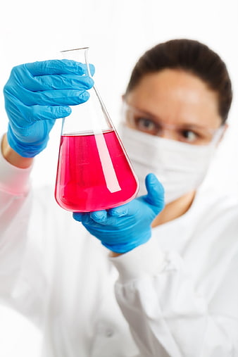 Female Scientist Examining Red Liquid in Erlenmeyer Flask