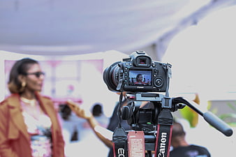 Professional DSLR Camera Filming Woman Interview