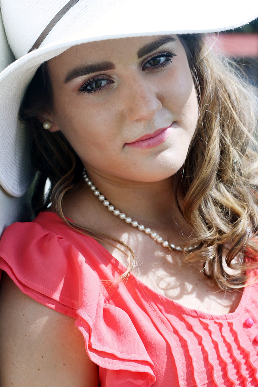 Portrait of Woman in White Hat and Pink Dress