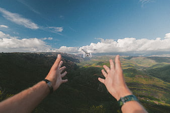 First Person View of Drone Flying Over Mountain Valley