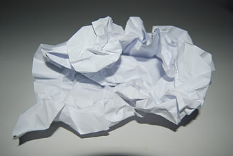 Crumpled White Paper Ball on Gray Surface