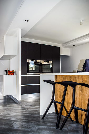 Modern Kitchen Interior with Black Cabinets and Wooden Island