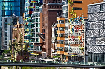Colorful Urban Architecture with Climbing Figures Sculpture