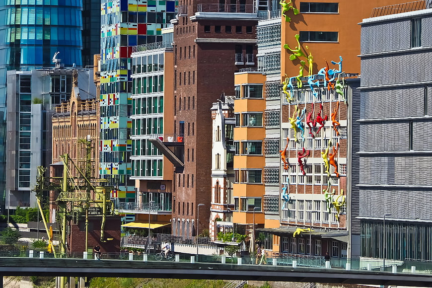 Colorful Urban Architecture with Climbing Figures Sculpture