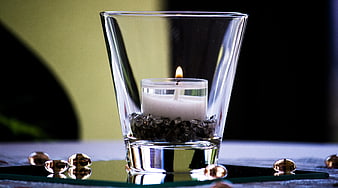 Lit Tea Light Candle in Glass Votive with Gold Marbles