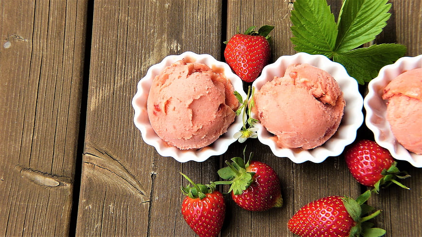 Fresh Strawberry Sorbet in White Bowls on Rustic Wood